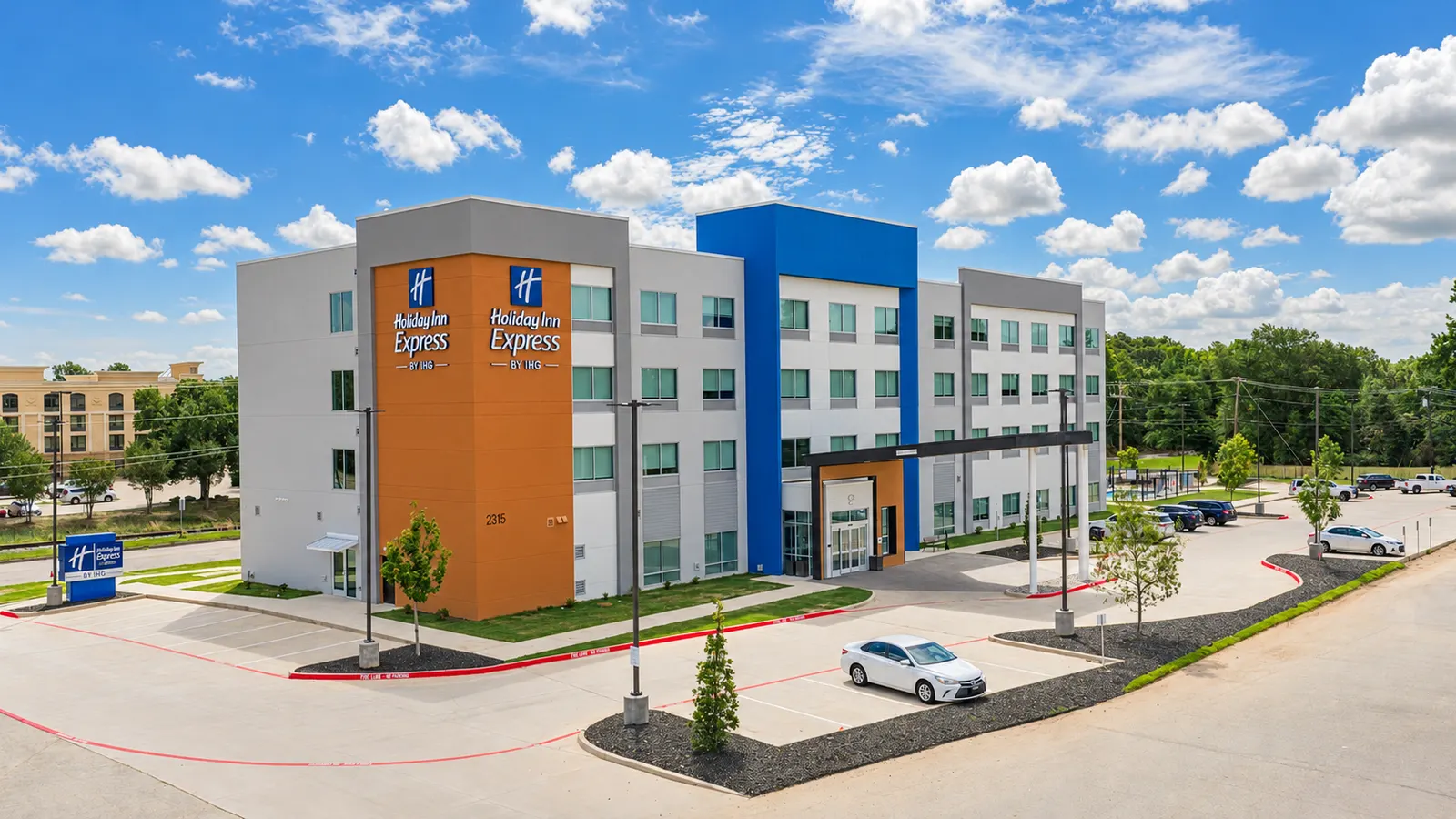 Exterior of Holiday Inn Express & Suites Tyler South beneath a blue sky